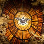 A window of yellow alabaster is illuminated at its centre with an image of the Dove of the Holy Spirit. This is above the Cathedra Petri or "Chair of St. Peter" altar at St. Peter's Basilica. The altar was created by Bernini. Bernini created a large b